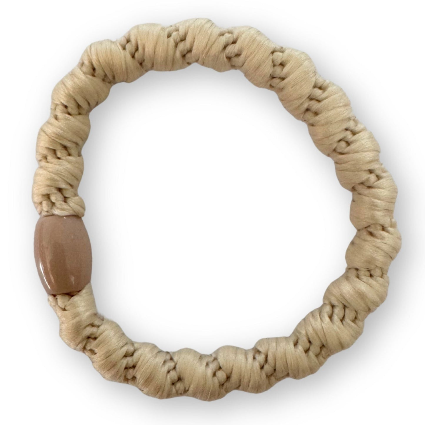 Beige hair tie a white background