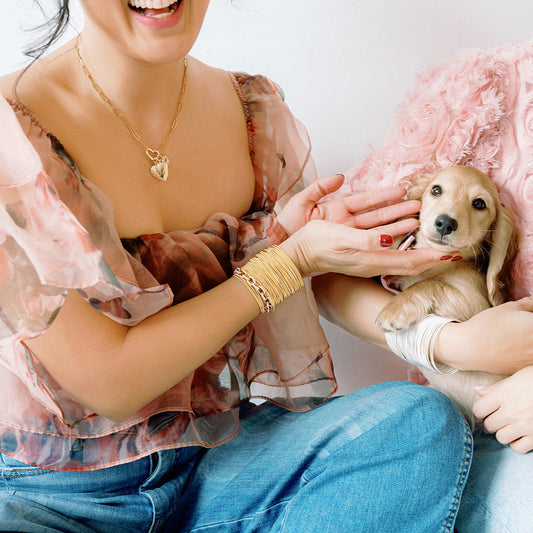 Model wearing Gold Heart Charm Chaine with Heart, puppy and Gold DIA