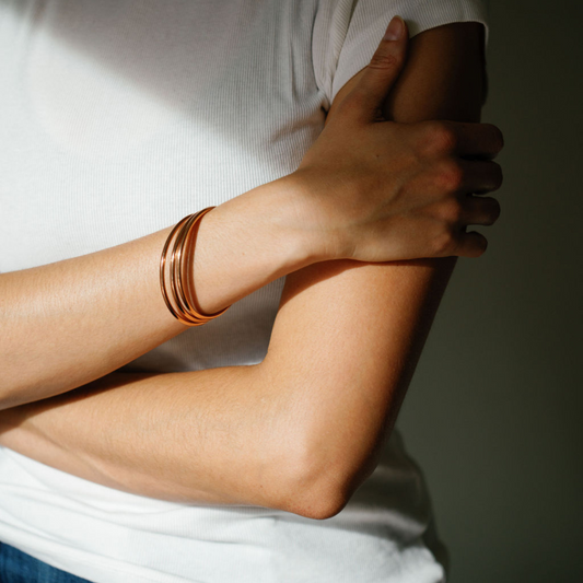 Rose Gold Luxe Bangles worn by model