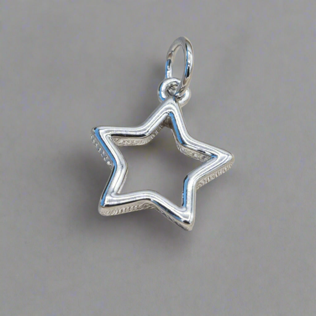 Silver_cut_out_star_charm