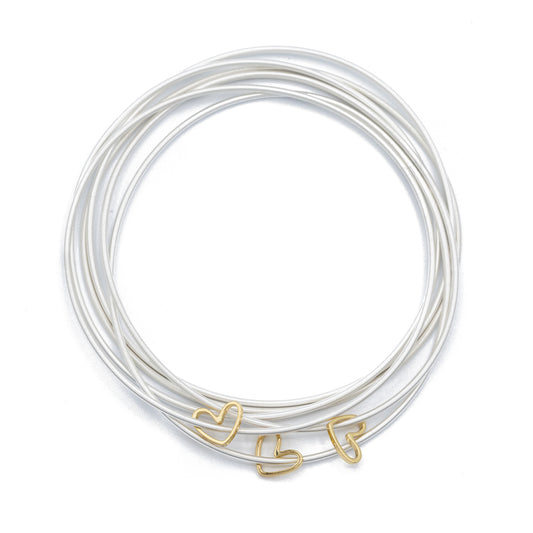 Three Gold Cut Out Heart Charms on Five Sterling DIA