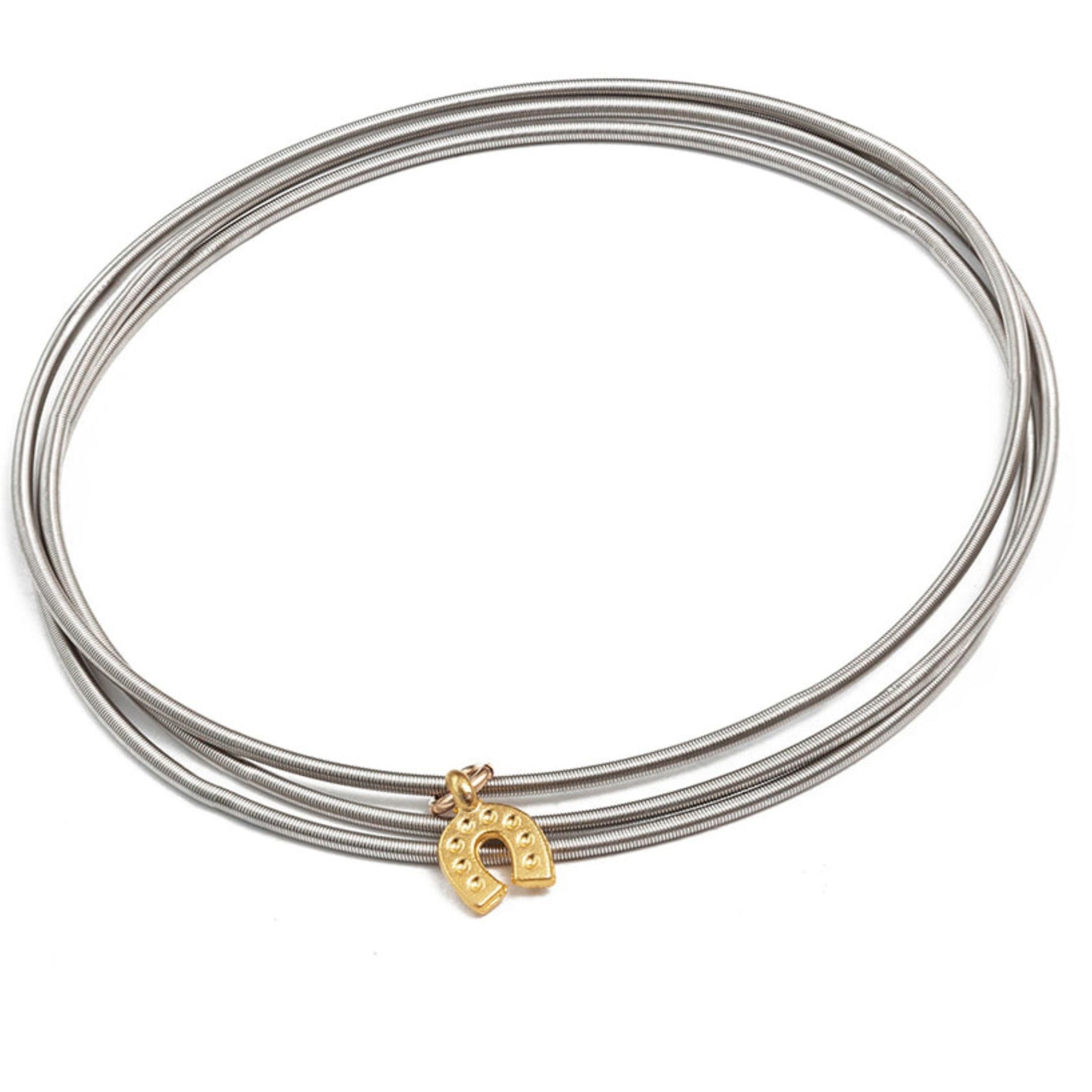 Gold horseshoe charm on stainless steel bracelets