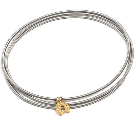 Gold horseshoe charm on stainless steel bracelets