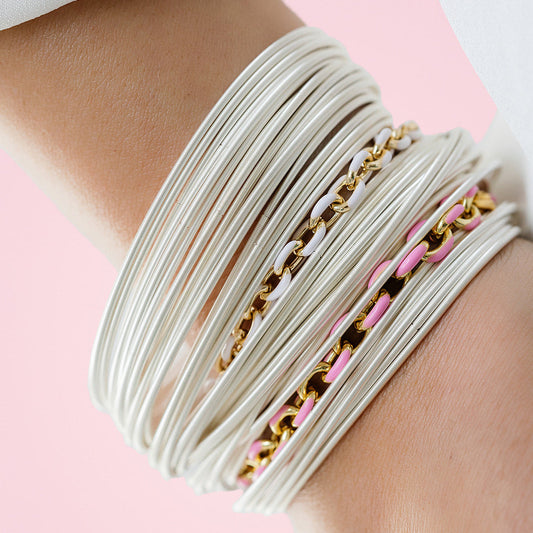 model wearing sterling DIA with white and pink enamel chain bracelets