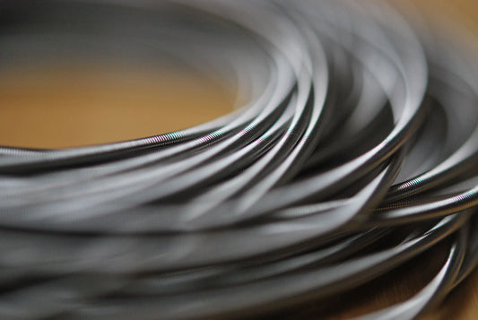 Close up of stainless steel spring bracelets