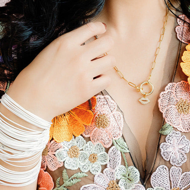 Model wearing Gold charm Necklace Chain with Kiss Charm