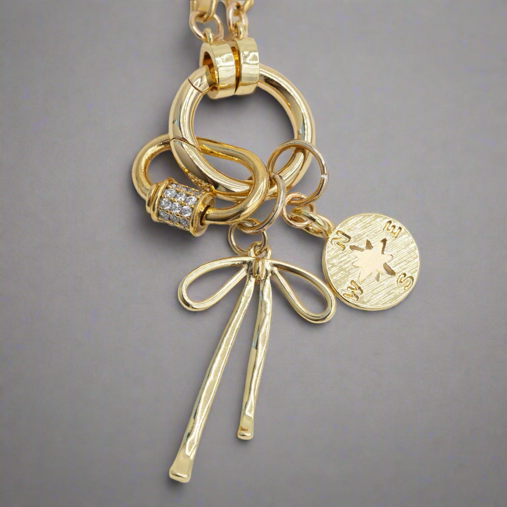 Gold Bow Charm on Necklace with other charms