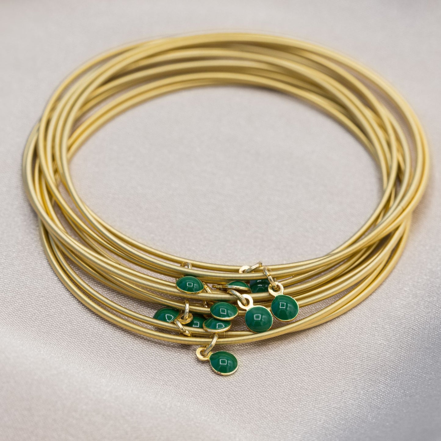 Gold DIA with green enamel disc charms