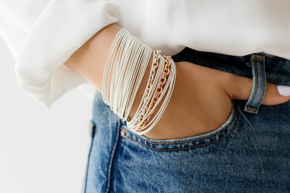 Model with a 6-inch wrist wearing 6.5-inch and 7-inch DIA bracelets side by side