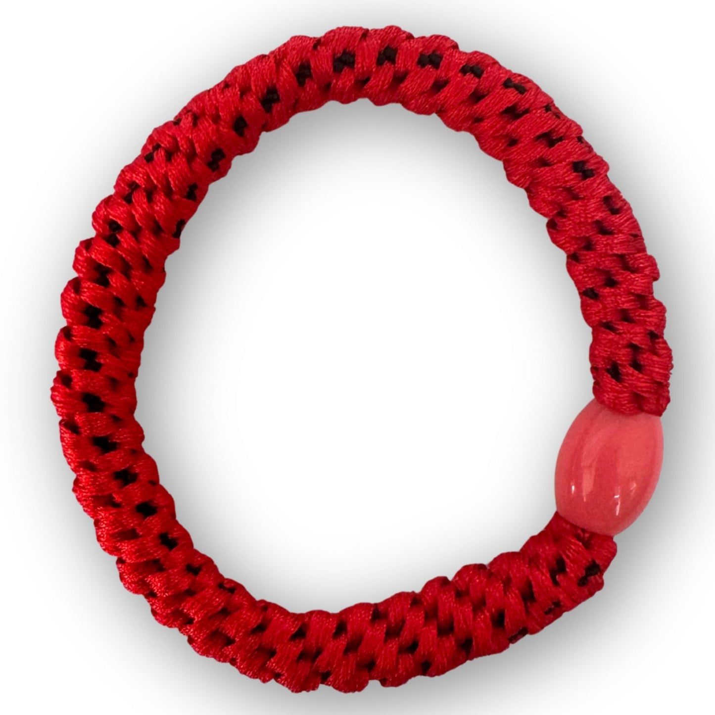 Red textured Hair tie with a pink bead on a white background