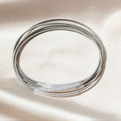 Silver Tube Charms on Stainless Steel Bracelet