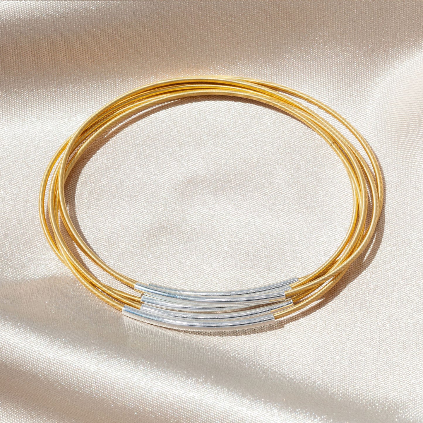 Silver Tubes on Gold Dia Bracelets