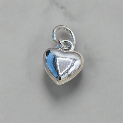 Silver puff heart charm