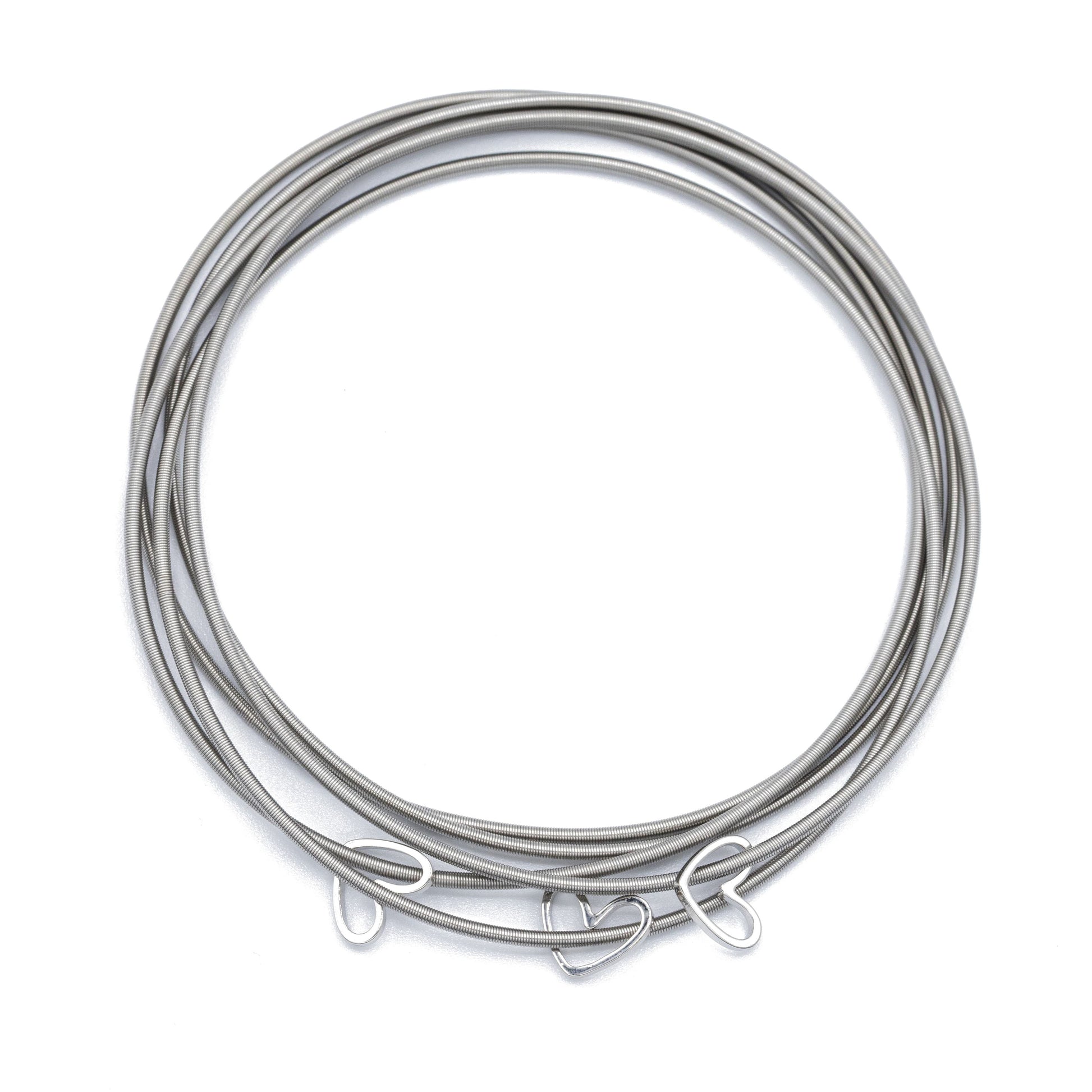 Three White Gold Cut Out Heart Charms on Five Stainless Steel DIA