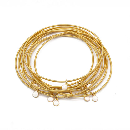 White enamel disc charms on Gold Dia