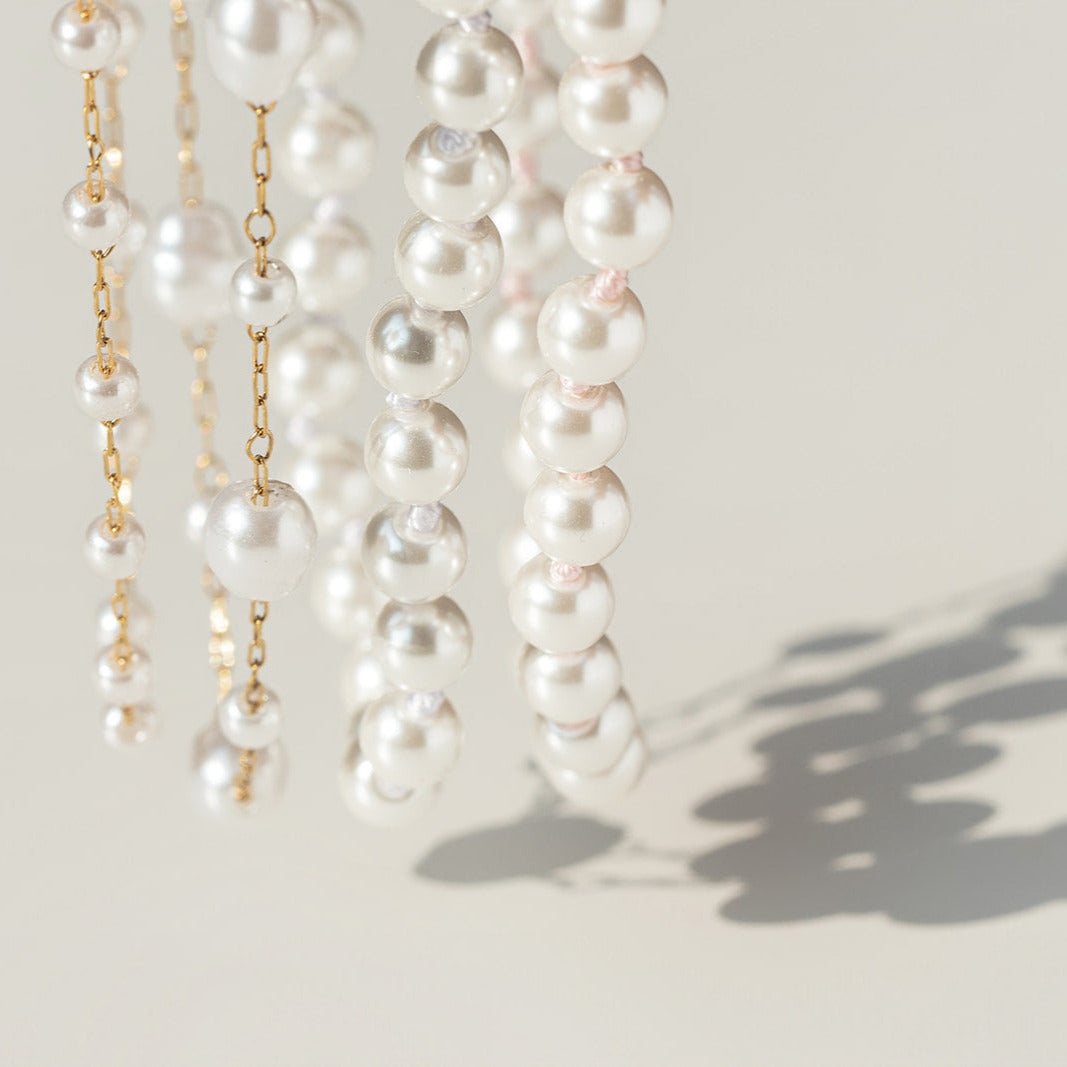 Pearl necklaces on a light background