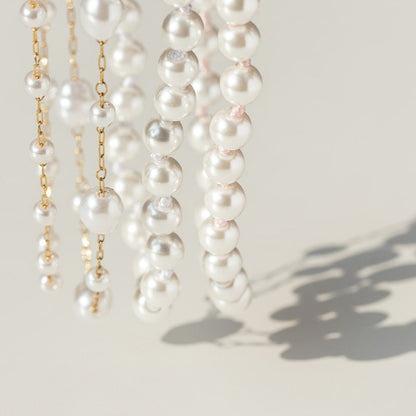 Pearl necklaces on a light background