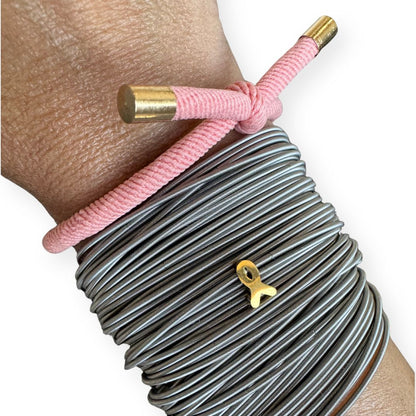 stainless steel dia pink hair tie and gold ribbon charm