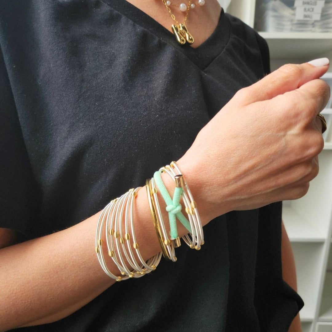 lifestyle hair tie on model with DIA Bracelets