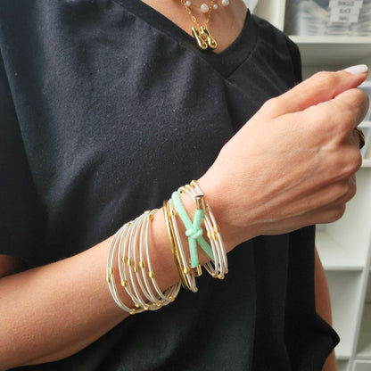 lifestyle hair tie on model with DIA Bracelets