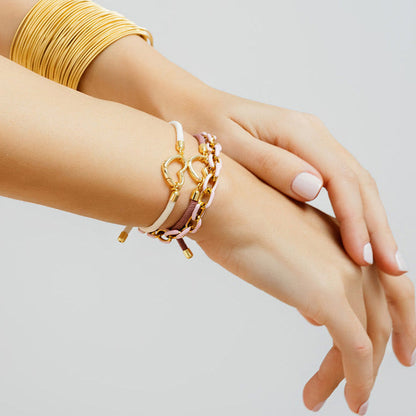 lifestyle wearing enamel chain bracelet with heart paracord bracelets and gold DIA bracelets
