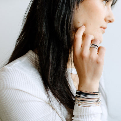 model wearing mixed metal dia rings