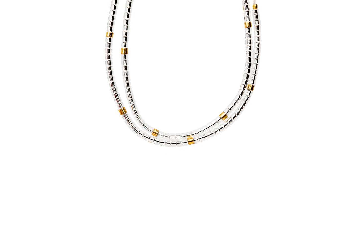 2 tiny beaded bracelets on string. Tiny silver  beads with a few gold beads throughout.